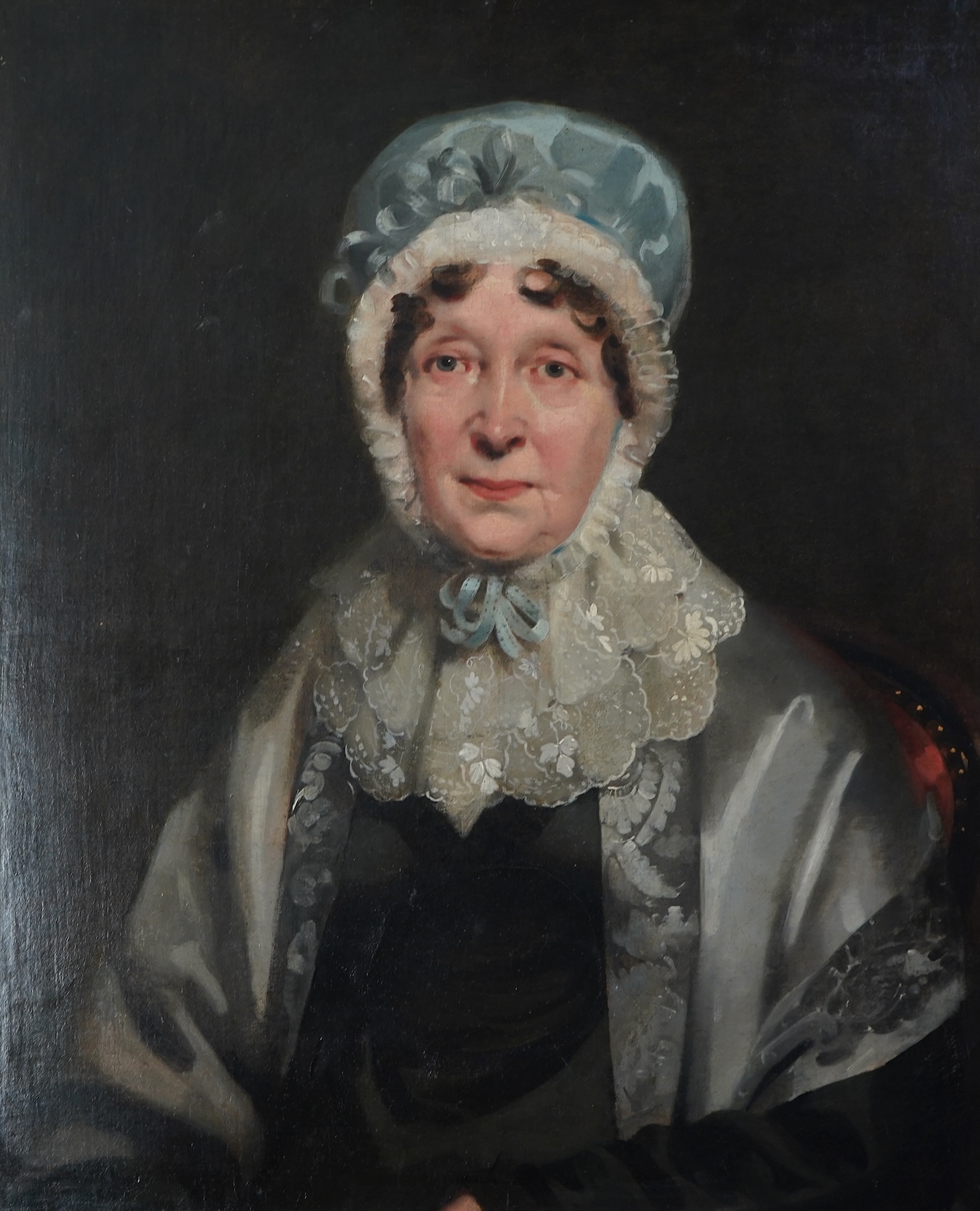 English School, 19th century, A portrait of a seated lady wearing a lace bonnet